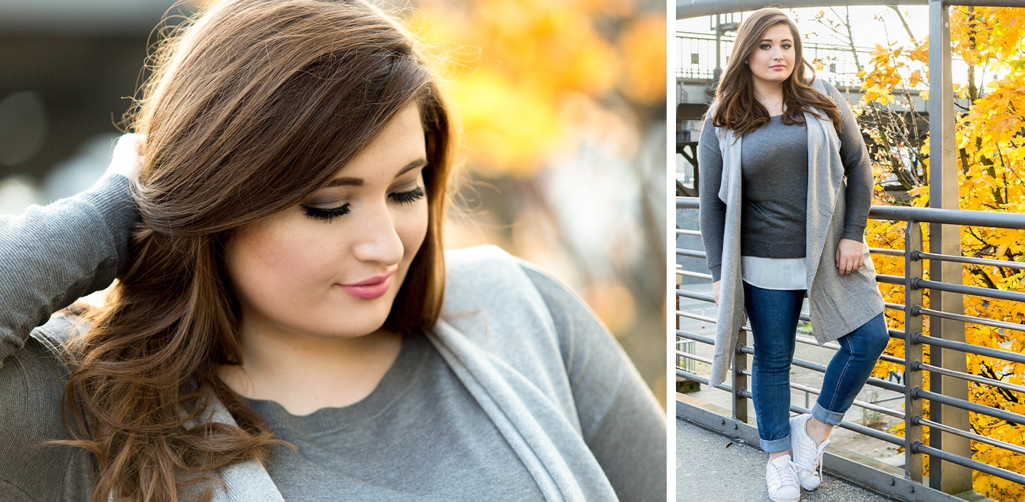 SchönWild Plus Size Model mit grauem Shirt, grauer Weste, Jeans und Adidas Superstars in Hamburg im Herbst